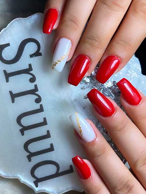Medium Red Coffin Nails with an Accent White Coffin Nail Adorned with Gold Glitter