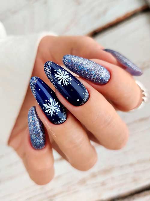 Long Almond Shaped Navy Blue Winter Nails with Glitter and Snowflakes