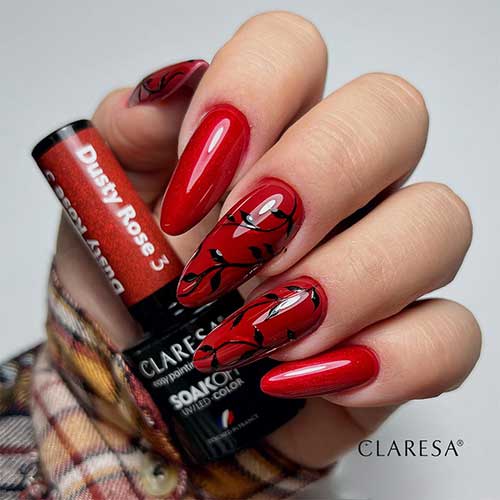 Red Nails with Black Leaf Nail Art Long Almond Shaped Red Nails with Black Leaf Nail Art