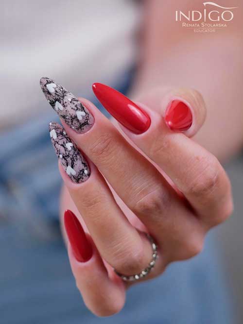 Unique Valentine’s Day Nails Long Almond Red Valentines Nails 2023 with Small White Hearts on Two Nude Accent Nails Decorated with Black Splatters