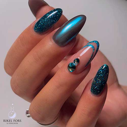 Long Almond Shaped Dark Teal Nails with Glitter, Rhinestones, and Chrome Accent Nails for Winter Season