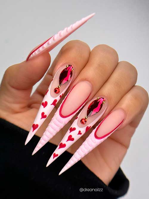 Pink Valentine’s Day Nails Long Stiletto Pink Valentine’s Day Nails 2023 with Red Hearts and Rhinestones