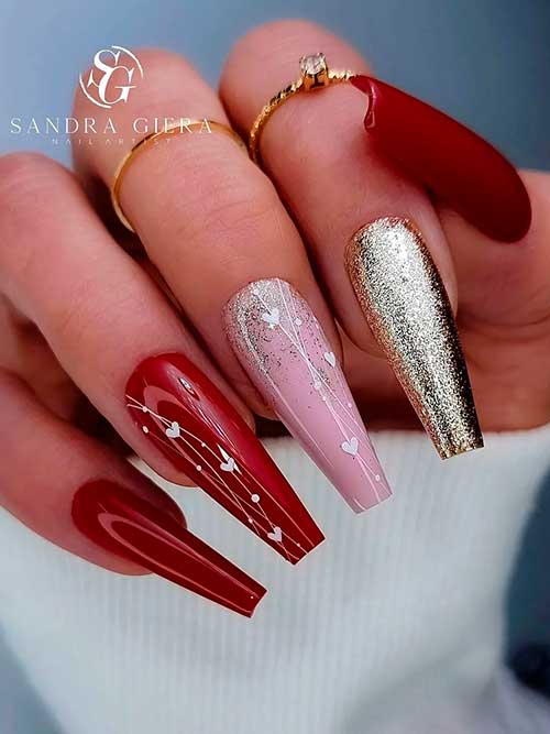 Long coffin dark red valentine’s nails with gold glitter and white hearts