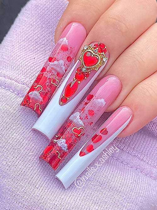 Long nude pink valentine nails with red heart glitter and two white French accent nails