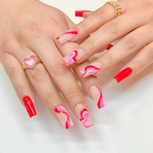 Long square groovy red and pink valentine nails 2023 with swirl nail art to celebrate love