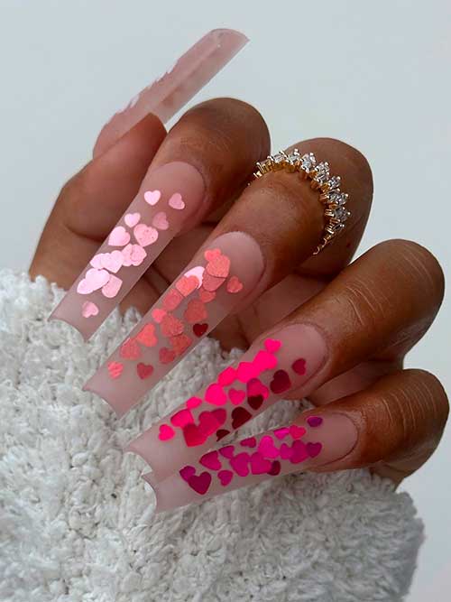 Long square-shaped nude valentines nails 2023 with different pink shade heart glitter