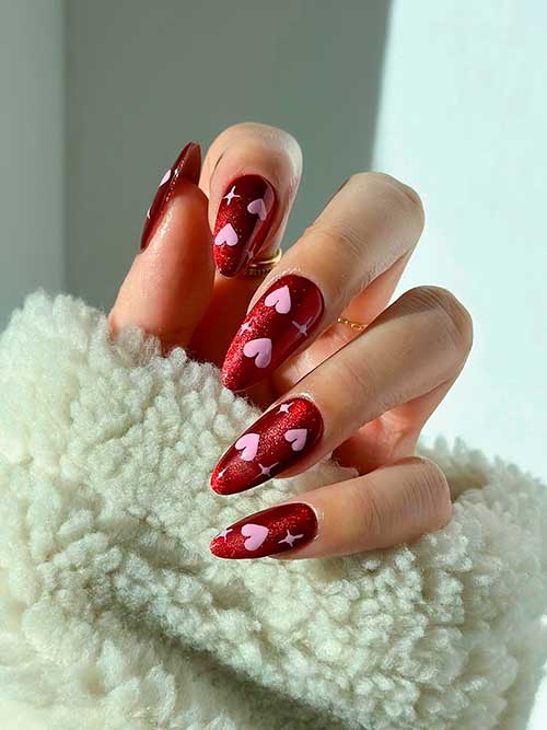 Shimmery Red Valentines Nails with Pink Hearts Medium almond shaped shimmery red valentines nails with pink hearts and stars