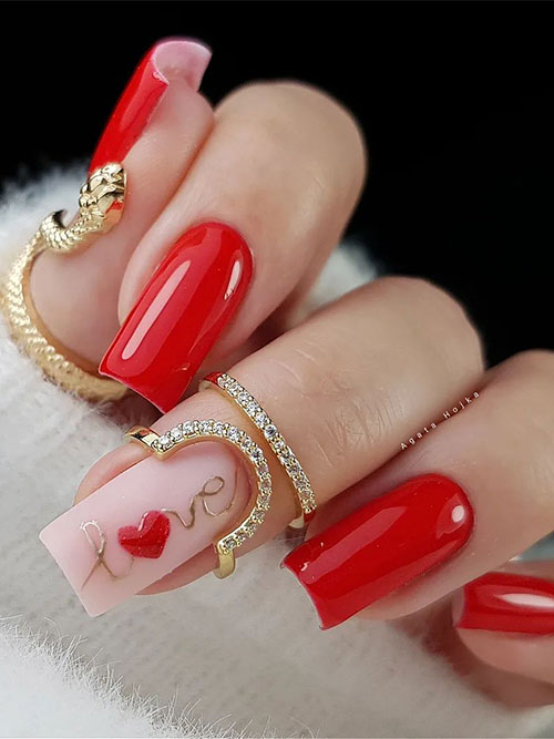 Red valentines nails with an accent nude pink nail adorned with gold “love” word with a red heart shape