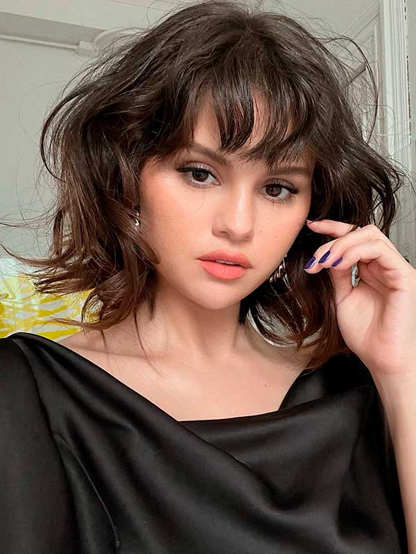 Short haircut with wispy bangs is one of the cutest on trend haircuts 2023