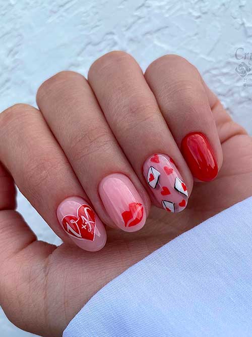 Short round shaped red and pink valentines nails with red hearts and lips