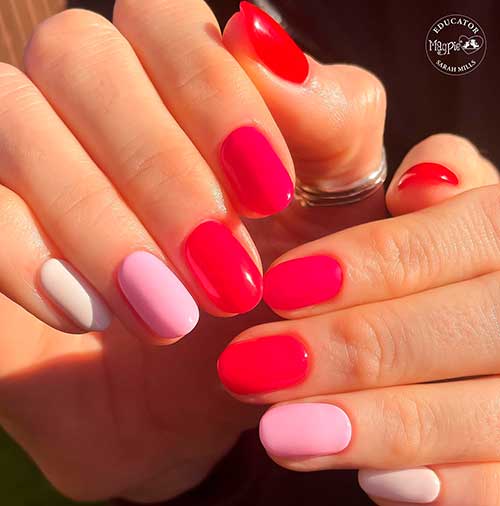 Short round shaped red, pink, and white valentine nails to celebrate love in 2023