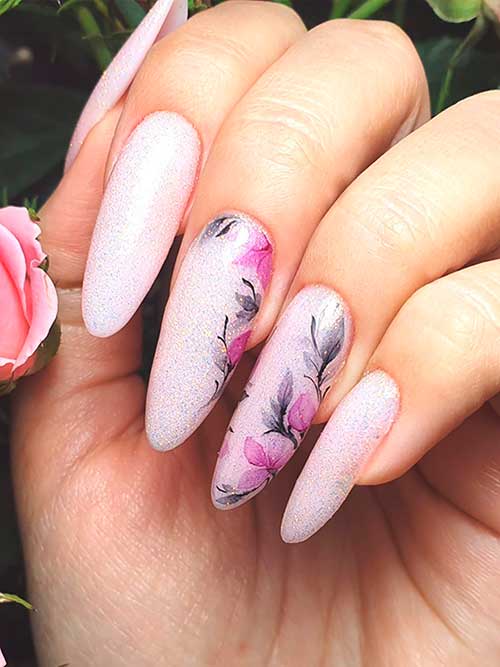 Long almond-shaped sparkling lavender spring nails with flowers on two accent nails