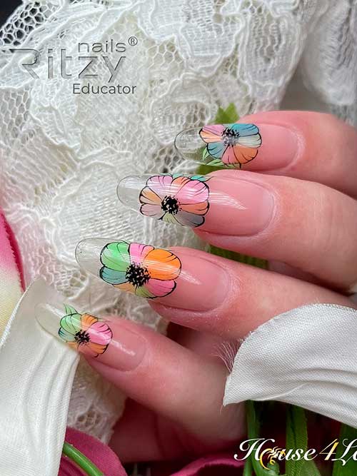 Long spring flower nails with pastel colors on clear acrylics which is one of the cutest spring nail ideas 2023