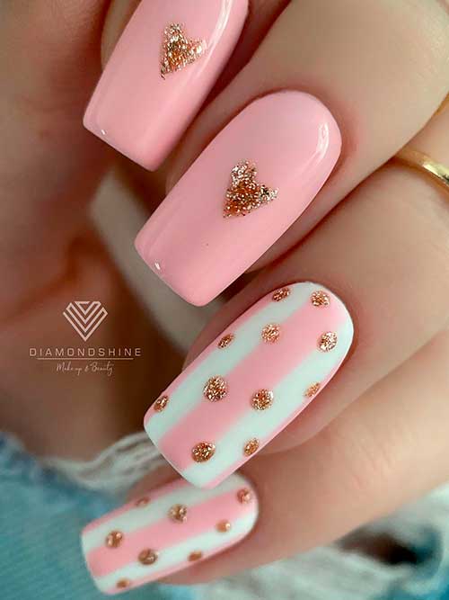 Elegant Pink Valentine’s Nails with Gold Glitter Hearts Long square-shaped elegant pink valentines nails with gold glitter hearts and dots