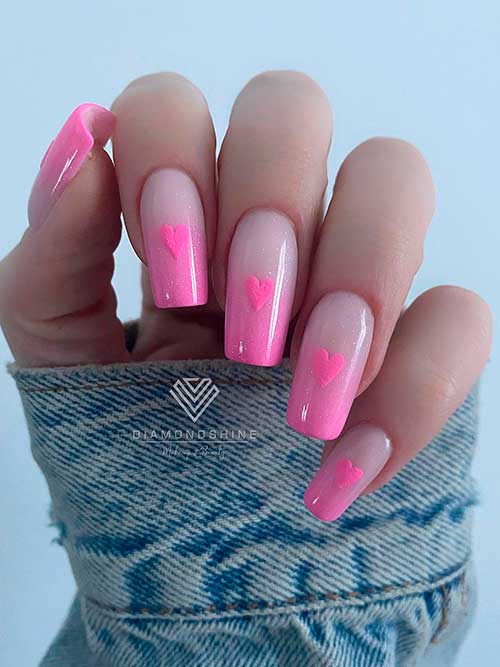 Long square-shaped ombre pink valentine’s day nails with a pink heart shape on each nail