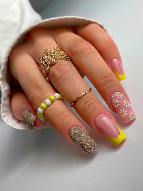 Medium square-shaped yellow French spring nails 2023 with flowers and glitter on accent nails