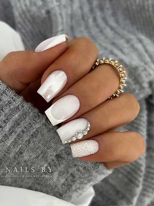 Classy milky nails Short milky French nails with chrome, glitter, and rhinestones on accent nails