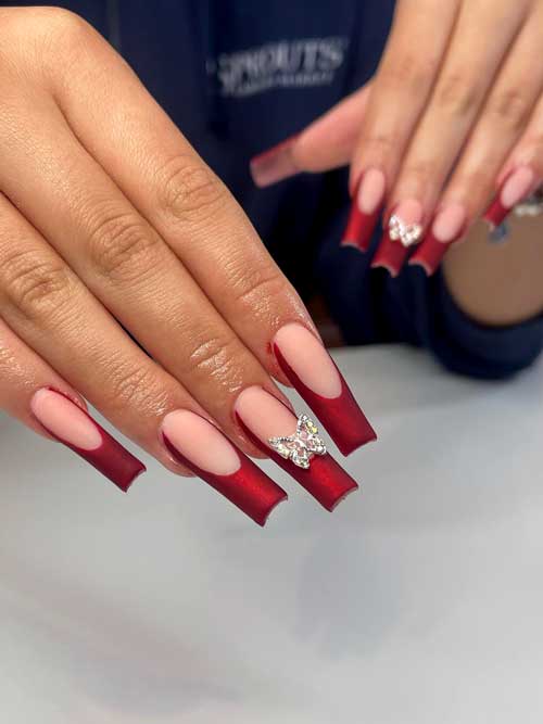 Long Red Velvet French Manicure with a Butterfly Rhinestone