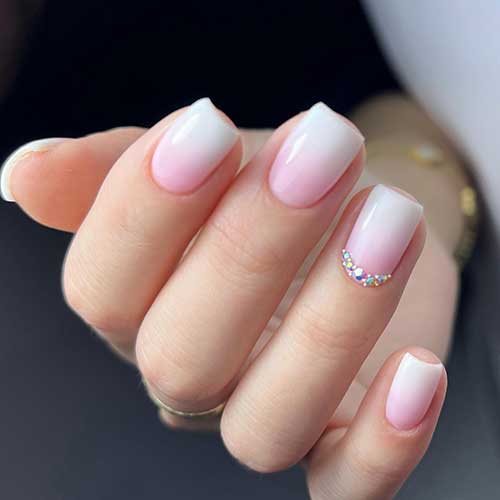 Short Baby Boomer Nails with Rhinestones on an Accent Nails are One of The Classy Short Nail Designs
