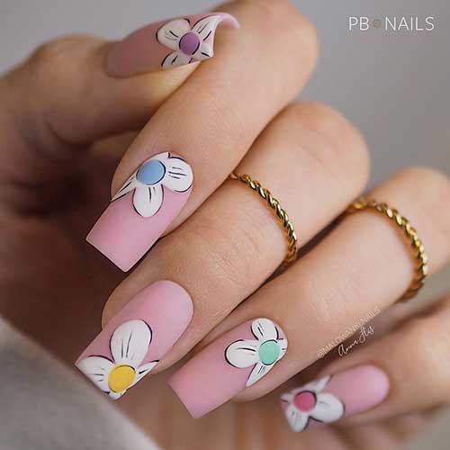 Medium square-shaped matte nude nails with floral nail art design