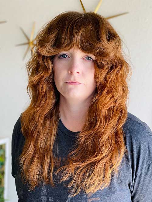 Razor cut long shag hairstyle for thick hair women Razor cut long shag hairstyle for thick hair women