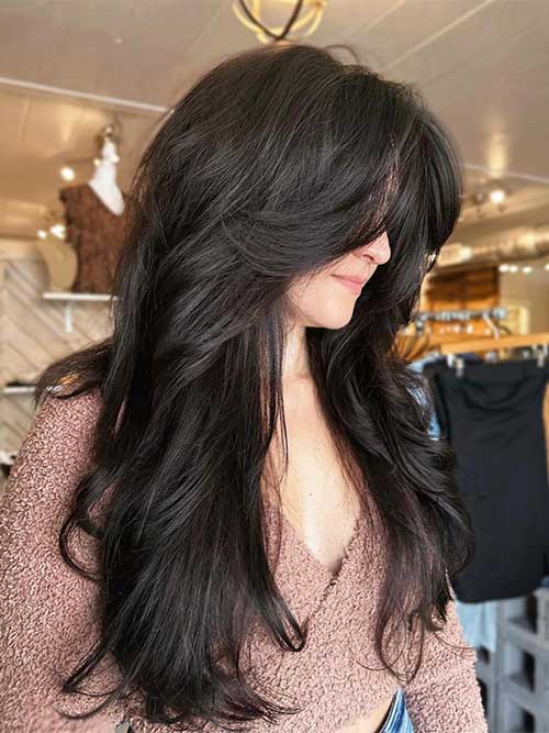 Sleek and straight long shaggy hair is one of the best long shaggy hairstyles for thick hair