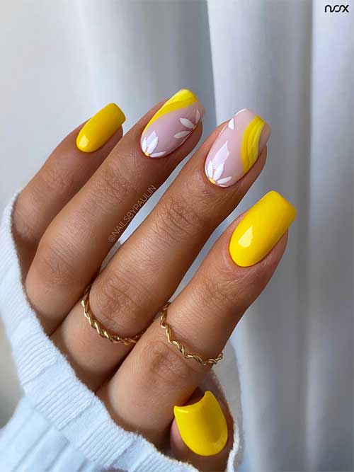 Short square bright yellow nails with daisy flowers on two accent nails for summer 2023