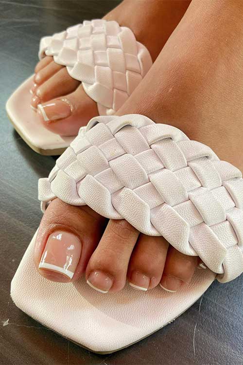 A classic French gel pedicure is a timeless and elegant look that is perfect for summertime. A classic French gel pedicure is a timeless and elegant look that is perfect for summertime.