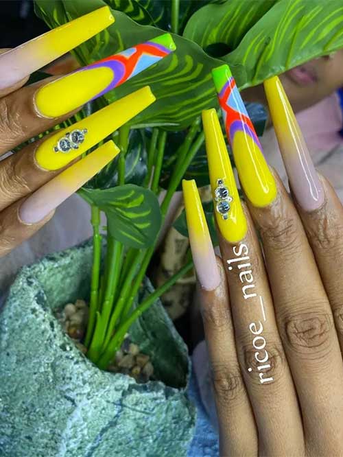 Coffin bright yellow acrylic nails with rhinestones, ombre, and colorful abstract nail art on accent nails