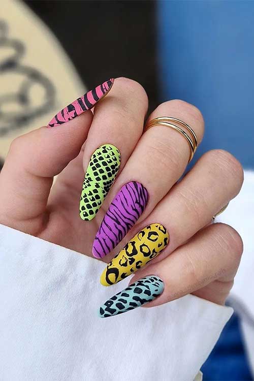 Long almond matte different animal print nails features snake, leopard, cheetah, and zebra prints