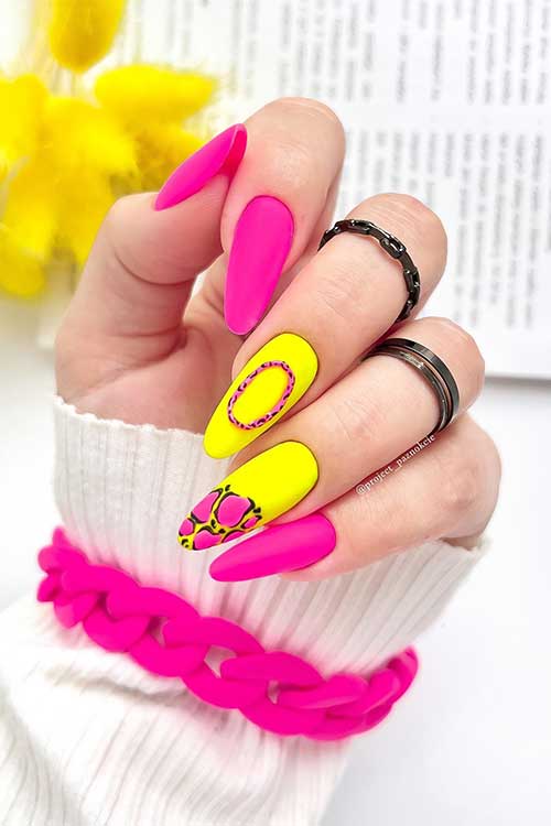 Long almond shaped matte pink and yellow neon nails with animal prints