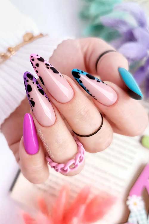 Long almond shaped pink blue and purple nails with cheetah prints on French tips
