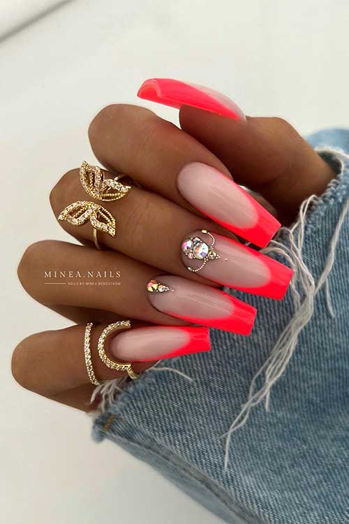 Long coffin bright neon orange summer French tip nails with rhinestones on two accent nails