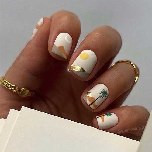 Off white abstract short summer nails with sun, moon, palm trees, and mountains