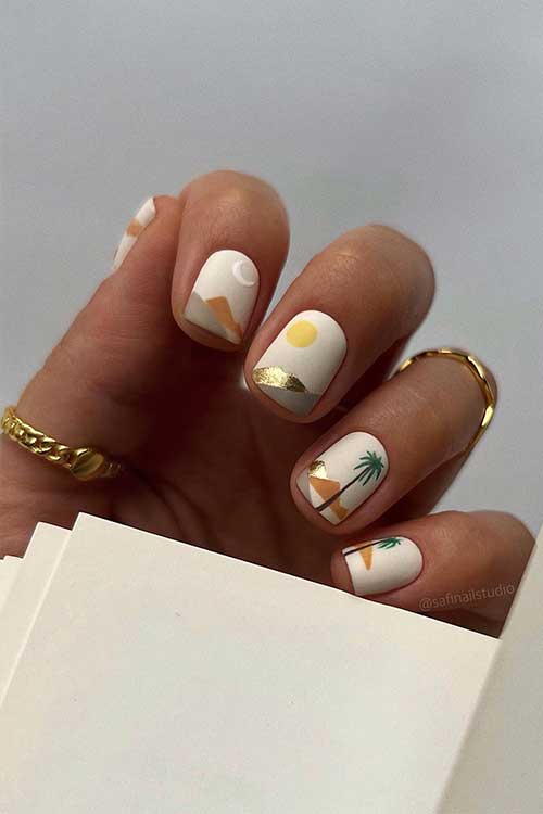 Off-white abstract short summer nails with sun, moon, palm trees, and mountains