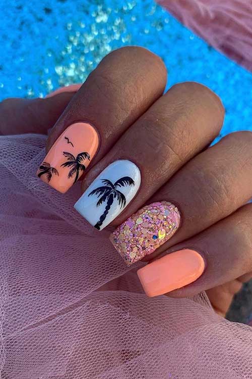 Square shaped short peach nails with palm trees, white, and glitter accent nails