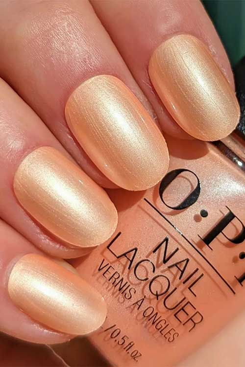 Short pearl peach nails using Sanding in Stilettos from the OPI summer Make the Rules collection