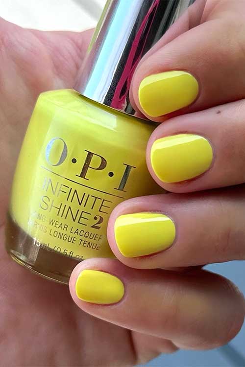 Short yellow nails using OPI Stay Out All Bright nail polish