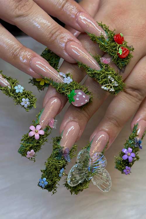 Long French garden fairy nails with 3d colorful flowers, butterflies, and strawberry