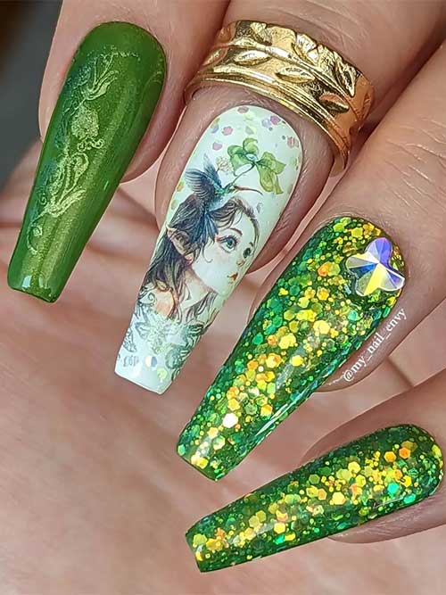 Long coffin glitter green fairy nails with elf fairy art on a white accent nail