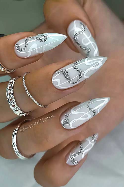 Long stiletto light grey gorgeous nails with white and silver glitter swirls