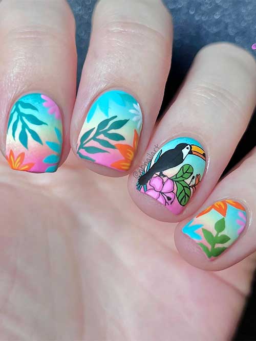 Short colorful tropical August nails with leaf nail art and a parrot