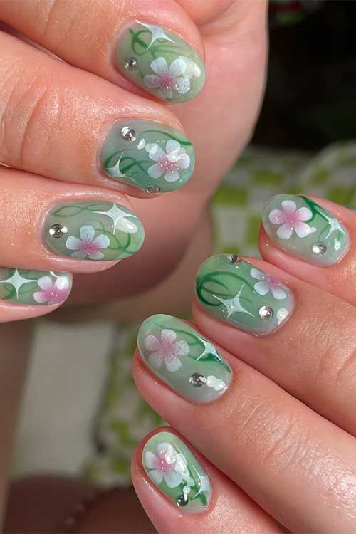 Short round shaped floral fairy nails with rhinestones