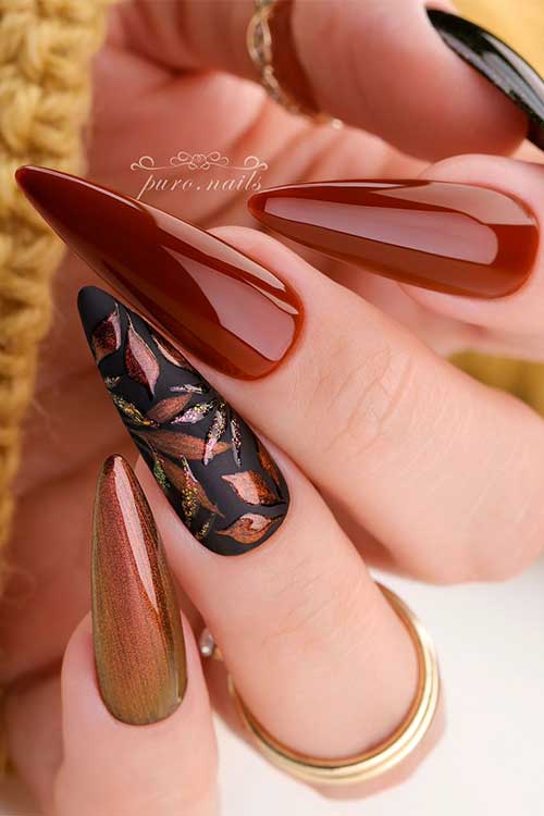Chestnut and black nails with chestnut leaves on an accent nail are one of the best September nail ideas to try Chestnut and black nails with chestnut leaves on an accent nail are one of the best September nail ideas to try
