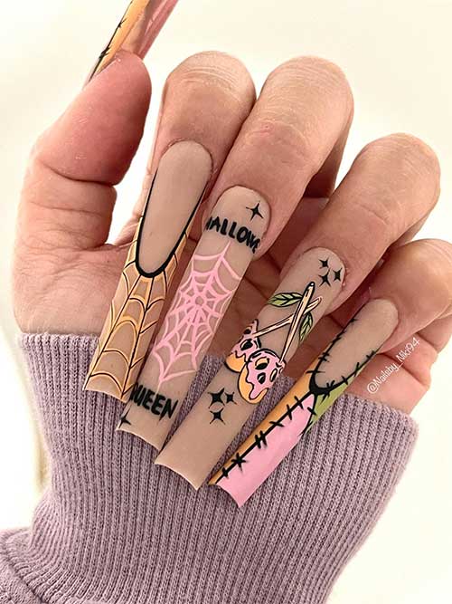 Dark beige nails with pink, burnt yellow, and green Halloween nail art designs such as skulls, stitches, and cobwebs. Dark beige nails with pink, burnt yellow, and green Halloween nail art designs such as skulls, stitches, and cobwebs.