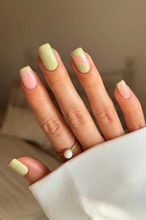 Fall green nails in an asparagus color hue with French tip accents and a negative space on an accent nail