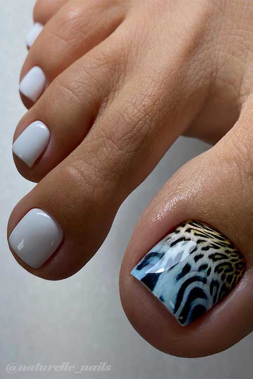 Grey toe nails with leopard animal prints on the big toe nail