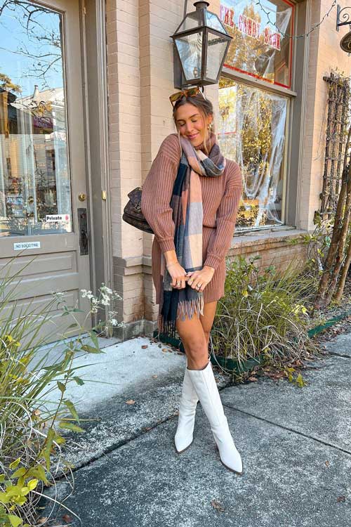 Light brown sweater dress paired with white knee boots