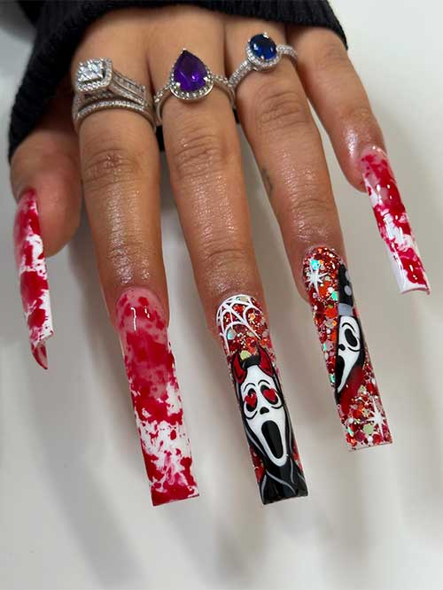 Long Spooky white French Halloween nails with blood splatters and two accent nails with a scary face, cobweb, and glitter.
