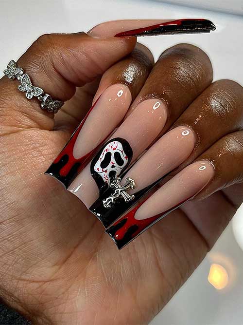 Long black French tip Halloween nails with blood drip nail art and a scary face on an accent black nail. Long black French tip Halloween nails with blood drip nail art and a scary face on an accent black nail.